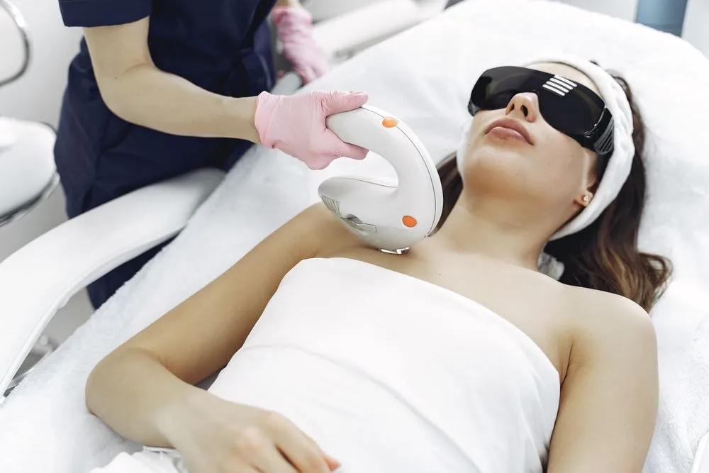Laser hair removal handpiece on skin
